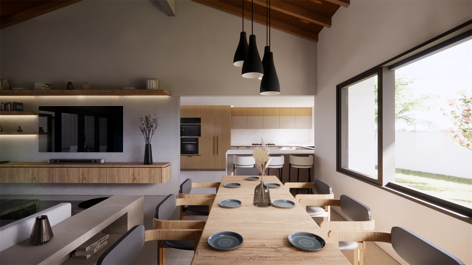 Villa Girouette — living, dining and kitchen under a vaulted timber ceiling.